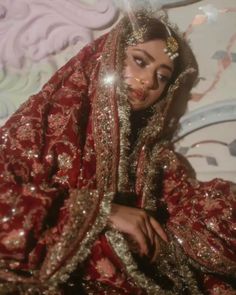 a woman in a red and gold outfit