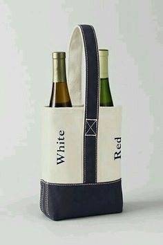 two bottles of wine in a tote bag with the words white and blue on it