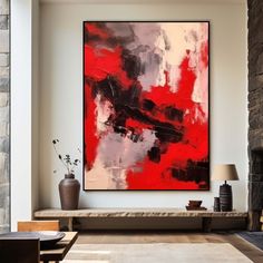 an abstract painting hangs in the living room