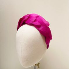 FABRIC This Women's fascinator headband is carefully hand made. The headband has been covered in a complementary crepe fabric and each feather has been attached within the seams of the fabric headband for a flawless finish. The head crown is light, soft and super comfortable and boasts a quality finish. FIT and SIZE A flexible base band to fit all head sizes.  PACKAGING Each headband is wrapped in pretty acid free tissue paper, sealed with an Evierosemade brand sticker and shipped in an eco-frie Pink Ostrich Feather Fascinator For Royal Ascot, Pink Pinched Crown Headpiece For Races, Pink Headband For Kentucky Derby, Pink Headband For Royal Ascot, Pink Structured Crown Headpiece For Races, Pink Headband For Races, Feather Headband For Royal Ascot, Pink Feather Fascinator For Royal Ascot, Adjustable Pink Feathered Fascinator