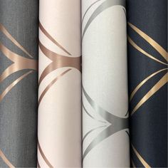 four different colored wallpapers with gold and silver designs on them, all lined up against one another