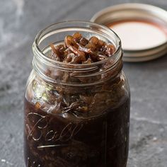 a jar filled with food sitting on top of a table