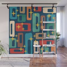 an abstract wall mural with stars and shapes