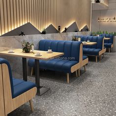 an image of a restaurant with blue chairs