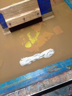 a wooden bench sitting in the middle of a flooded area next to a wall with graffiti on it