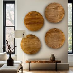 three wooden plates mounted on the wall in a living room