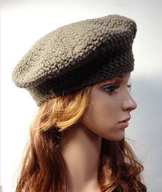 a mannequin head wearing a knitted hat