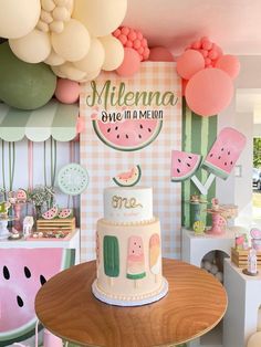 a watermelon themed birthday party with balloons