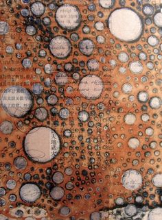 an abstract painting with lots of circles on it's surface and words written in the middle