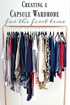 a rack with clothes hanging on it and the words creating a capsule wardrobe