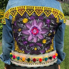 Lotus Jacket, Embroidered Purple Lotus Jacket, Kuchi Beaded Belt, Multi Color Pom Pom Belt, Kuchi/Banjara Belly Dance Belt Jacket Boyfriend Style Denim Jacket. -Embellished Soft Blue Denim Jacket With Kuchi/Banjara Patches Imported From India And Pakistan -Patches Hand Sewn All On The Back And Continue To Shoulders/Sleeves. -Classic Blue Denim Jacket. -Condition: Brand New. -Size: L (Jr) Fits Women S/M Or Junior L -Materials: Denim Jean Jacket, Beads, Colorful Pom Poms, Studs, Kuchi Belt Blue Embroidered Long Sleeve Denim Jacket, Bohemian Embroidered Blue Denim Jacket, Bohemian Blue Embroidered Denim Jacket, Blue Long Sleeve Denim Jacket For Festival, Bohemian Embroidered Multicolor Denim Jacket, Embroidered Purple Long Sleeve Outerwear, Purple Embroidered Long Sleeve Outerwear, Embroidered Long Sleeve Purple Outerwear, Purple Long Sleeve Embroidered Outerwear