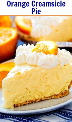 a slice of cheesecake with oranges in the background