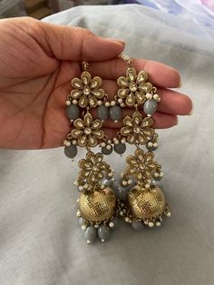 Plz let us know within 24hrs of receiving item if there is any issue with it and post within 7days of delivery. This listing comprises of a beautifully designed Good Quality Big Size Earrings with Saharey! The pic shown is of the real product and you will receive exactly what Is shown in the pic. The drop of the earrings is 11cm approx  So plz buy with confidence 😊 Many thanks for visiting my shop snd hope you could find the perfect set to suit the occasion x Any Questions? Plz Ask? Luxury Hand-set Round Chandelier Earrings, Luxury Gold-tone Earrings For Statement Jewelry, Luxury Yellow Gold Round Beads Earrings, Luxury Gold Large Beads, Rani Haar, Pakistani Jewelry, German Silver, Temple Jewellery, Chain Earrings