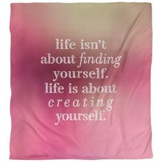 a pink and white blanket with the words life isn't about finding yourself