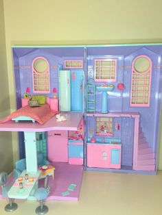 a doll house with furniture and accessories inside