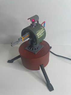 3d printed auto turret based off the in game turret from 'Rust' This turret is fully operational and moves 90 degrees, with a working laser mounted on top - just like the in-game turret. There is a cheaper, non motorised alternative that does not include these features. This turret is 3d printed with eco friendly filament and measures roughly 11.5cm (W) by 11.5cm (H). All turrets are made to order and can include either an AK or Bolt rifle. Every item we sell is hand filed, primed, painted and a Rust Game, 90 Degrees, 3d Printed, Rust, Eco Friendly, Electronic Accessories, Electronics, Fan Art, Fan