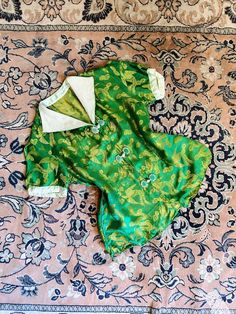 RESERVED FOR ALLIE!! |d e s c r i p t i o n| *circa 1940s *gorgeous green silk blouse, likely from a 40s loungewear set  *green and gold silk brocade fabric  *fantastic textured art deco collar  *frog closures up front  |i n f o| tag: none  condition: good vintage condition. staining/color transfer on closure up front. Shirt shrunk slightly during washing and puckered collar underneath. Missing original belt.  |m e a s u r e m e n t s| bust: 34" & under for best fit  waist: 32" bottom: 38" lengt