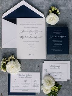 the wedding stationery was done in navy and white