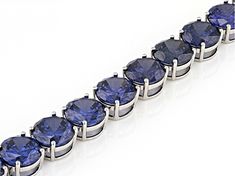 Bella Luce® Esotica™ 91.78ctw tanzanite simulant round, rhodium over sterling silver tennis bracelet. Measures approximately 7.25-8" L x 0.31" W and has a box clasp closure. Round Tanzanite Bracelets For Formal Occasions, Silver Tanzanite Bracelets For Formal Occasions, Formal Tanzanite Round Bracelets, Polished Tennis Bracelet For Gifts, Silver Tanzanite Bracelet In Fine Jewelry Style, Silver Tanzanite Bracelet Fine Jewelry, Formal Faceted Tanzanite Jewelry, Sapphire Brilliant Cut Tennis Bracelet, Silver Tanzanite Round Stone Jewelry