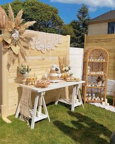 a table with some food on it in the grass