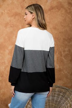 ROUND NECK, PUFF SLEEVE, COLOR BLOCK TOP COLOR: IVORY-2TONE CHARCOAL-BLACK Fabric Content: 95% Polyester, 5% Spandex SIZES BUST WAIST HIPS XS 0 31 23 33 1 32 24 34 S 3 33-34 25 35-36 5 34-35 26 36-37 M 7 36-37 27 37-38 9 37-38 28 38-39 L 11 39-40 29-30 39-40 13 40-41 31-32 41-42 XL/1X 14 42-43 33-34 43-44 16 43-44 35-36 44-45 2X 18 45-46 37-38 45-46 20 46-47 39-40 46-47 3X 22 48-49 41-42 48-49 24 49-50 43-44 50-51 Black Long Sleeve Color Block Tops, Casual Tops With Contrast Panels For Layering, Casual Top With Contrast Panels For Layering, Loungewear Tops With Contrast Color Crew Neck, White Contrast Color Top For Loungewear, White Tops With Contrast Color For Loungewear, Sporty Contrast Color Tops For Fall, Black Long Sleeve Tops With Contrast Panels, Sporty Color Block Top For Fall