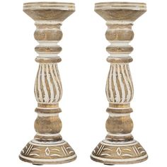 two wooden candlesticks sitting next to each other