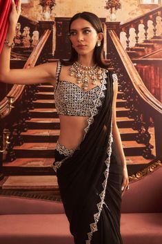 Embrace modern elegance with this black embellished blouse, beautifully paired with a pre-draped sari. The intricate embellishments bring a touch of glamour, while the pre-draped design offers effortless grace, making this ensemble perfect for any festive occasion or evening event. Vacuum Storage, Drape Saree, Black Drapes, Ready To Wear Saree, Indian Wedding Wear, Embellished Jacket, Embellished Blouse, Sleeves Blouse, Designer Drapes