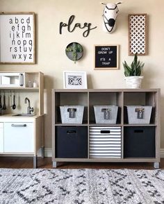 a living room filled with lots of furniture and pictures on the wall next to a rug