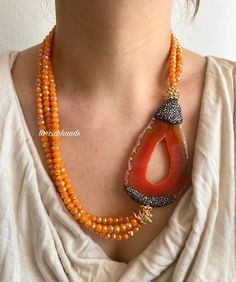 🧡Gold-Plated Multistrand Necklace with Orange Glass Crystals & Agate Slice🧡 Add a touch of bohemian elegance to your style with our **Gold-Plated Multistrand Necklace**. This stunning piece features vibrant orange glass crystals and a bold agate slice, perfect for making a statement. ✨ **High-Quality Materials Handcrafted with gold plating, this necklace shines with a luxurious finish. The gold plating ensures durability, while the multistrand design adds depth and dimension to your look. 🍊 * Luxury Orange Gemstone Beaded Necklace, Luxury Multicolor Carnelian Beaded Necklaces, Luxury Orange Hand-strung Beaded Necklaces, Luxury Spiritual Orange Beaded Necklace, Luxury Orange Spiritual Necklace, Luxury Spiritual Orange Necklace, Luxury Orange Spiritual Necklaces, Elegant Agate Crystal Necklace With Faceted Beads, Long Agate Beaded Necklace With Faceted Beads