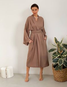 🌿Maxi linen wrap kimono dress with fabric belt. The belt fixes the waist well, and the pockets are made for your comfort and convenience. You can wear this stylish kimono at home or on the walk, apply kimono, as a cardigan, summer cloak. You will be delighted with this kimono dress in Bohemian style. MORE: https://www.etsy.com/shop/ArtVyshyvankaUA?ref=seller-platform-mcnav§ion_id=38397051 The height of the model on photo is 170 cm ( 5.7 ) Fabric: 100% linen ------------------------------------- Elegant Linen Kimono With Kimono Sleeves, Elegant Belted Wrap Dress With Kimono Sleeves, Beige Wrap Dress With Tie Waist, Spring Wrap Dress With Belted Kimono Sleeves, Chic Wrap Dress With Belted Kimono Sleeves, Chic Wrap Dress With Kimono Sleeves And Belt, Chic Belted Wrap Dress With Kimono Sleeves, Summer Cloak, Wrap Long Dress