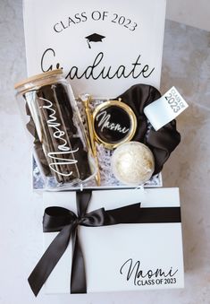 a graduation gift box filled with personalized items