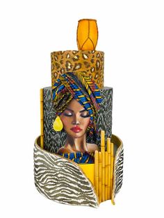 an artistically designed pen holder made out of zebra print paper and gold colored pencils