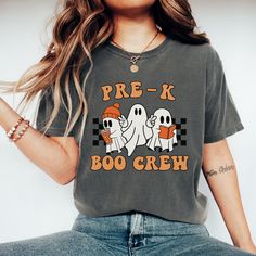 You will love this Halloween pre-k boo crew shirt! This is the perfect trendy tee for pre-k teachers and  pre-k teacher teams to wear during the fall/Halloween season and makes a great Halloween gift for teacher teams! PRODUCTION TIME: 2-5 business days  SHIPPING TIME: 2-5 business days  PRODUCT DESCRIPTION: These ultra soft pigment dyed shirts are one of our best sellers, 100% Cotton. 100% ring spun cotton Preshrunk, soft-washed, garment-dyed fabric Set-in sleeves Double-needle stitched sleeves Trendy Fall T-shirt For School, Fall School Spirit Graphic T-shirt, School Crew Neck T-shirt For Fall, Crew Neck T-shirt For School In Fall, Casual Fall T-shirt For School, School Spirit Crew Neck T-shirt With Character Print, School Spirit T-shirt With Character Print, Trendy School T-shirt For Fall, Halloween Crew Neck Soft-washed T-shirt