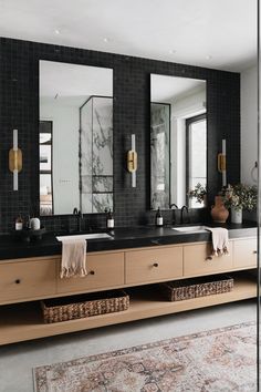 the instagram page shows an image of a bathroom with black tile and gold accents