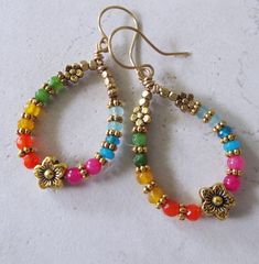 "Multi Colored Jade Flower Dangle Hoop Earrings on Brass Wires 2.25\" Long. These are super colorful and pretty." Handmade Multicolor Hoop Earrings For Spring, Multicolor Bohemian Hoop Earrings For Spring, Spring Multicolor Teardrop Jewelry, Multicolor Dangle Hoop Earrings For Spring, Multicolor Teardrop Earrings For Spring, Spring Multicolor Teardrop Earrings, Multicolor Small Hoop Jewelry For Spring, Rainbow Bohemian Jewelry For Spring, Bohemian Rainbow Jewelry For Spring