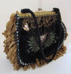 An exquisite needlepoint bag with heavy embellishments. Excellent clean condition inside & out. Ball snap closure. Clean gold ochre moire silk interior with side pockets. Each side is different. Black cord strap. Bee pin. Black rosettes, lace & crinkled ochre fringe. A true work of art. Paypal Payments Only Please! When auction concludes payments must be made within 3 days. Immediate Payment Appreciated. “Buy It Now” items must be paid immediately.  If you have a broken item or feel the item was Antique Embroidered Evening Bags, Vintage Embellished Pouch Bag, Vintage Embellished Rectangular Bag, Embroidered Rectangular Bag For Vintage Events, Embroidered Rectangular Bags For Vintage Events, Rectangular Embroidered Bags For Vintage Events, Victorian Embroidered Evening Bags, Vintage Embellished Clutch Shoulder Bag, Vintage Embellished Rectangular Shoulder Bag