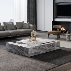 a living room with couches, tables and a fireplace in the corner on top of carpeted flooring