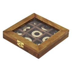 a wooden box that has some type of game in it's center and numbers on the inside