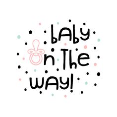 the words baby on the way written in black and pink ink with polka dots around it