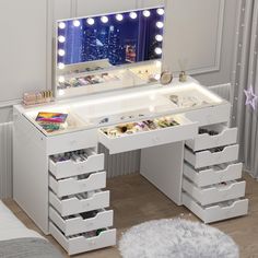 a white vanity with drawers and lights on it