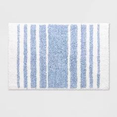 a blue and white rug with stripes on it