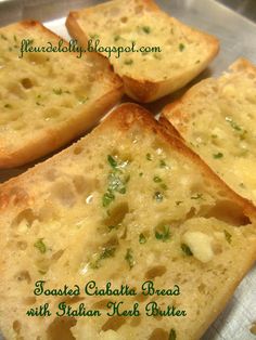 four pieces of bread with cheese and herbs on them