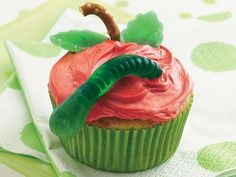 a cupcake with a worm on top of it