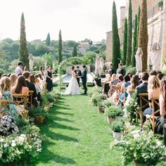 an outdoor wedding ceremony in the garden