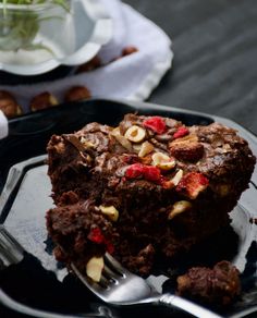 a piece of chocolate cake on a plate with a fork