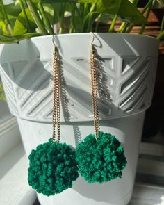 Dark forest green pompom earrings on a gold chain Luxury Green Earrings For Festivals, Forest Green Earrings, Green Tassel Drop Earrings For Party, Festive Green Dual-tone Earrings, Vibrant Green Dangle Earrings, Pompom Earrings, Dark Forest Green, Dark Forest, Forest Green