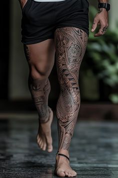 a man with tattoos on his legs and leggings is walking down the street