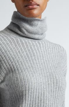 Mixed-width ribbing lends varied texture to a trim turtleneck sweater knit from a luxurious blend of virgin wool and cashmere. Turtleneck Long sleeves Dropped shoulders 92% virgin wool, 8% cashmere Dry clean Made in Italy Designer Clothing Winter Cashmere Sweater With Ribbed Neckline, High Neck Cashmere Sweater With Ribbed Collar, Elegant Cashmere Sweater With Funnel Neck, Ribbed Funnel Neck Cashmere Sweater, Classic Wool Ribbed Turtleneck, Classic Ribbed Wool Turtleneck, Elegant Winter Sweater With Ribbed Neckline, Elegant Ribbed Turtleneck Sweater, Workwear Ribbed Cashmere Turtleneck