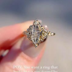 a woman's hand holding an engagement ring with the words pov you want a ring that looks like it was forced by