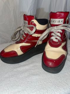 These tennis shoes were purchased in London in 1996 and lovingly worn so there are a few scuff marks but still in great shape!  They are red and white pantent leather with platforms!! Google lens couldn't find anything like them!! Retro Platform Sneakers With Contrast Sole, Red Retro Leather Sneakers, Retro Leather Sneakers With Red Sole, Red High-top Platform Sneakers With Rubber Sole, Red High-top Platform Sneakers, Red Platform Sneakers With Red Sole, Red Low-top Platform Sneakers, Retro High-top Platform Sneakers, Red High-top Platform Sneakers For Streetwear